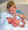 Wesley Campbell Gries being fed by his big brother Chas  Born 11/24/03  8lbs  2oz  21.5"